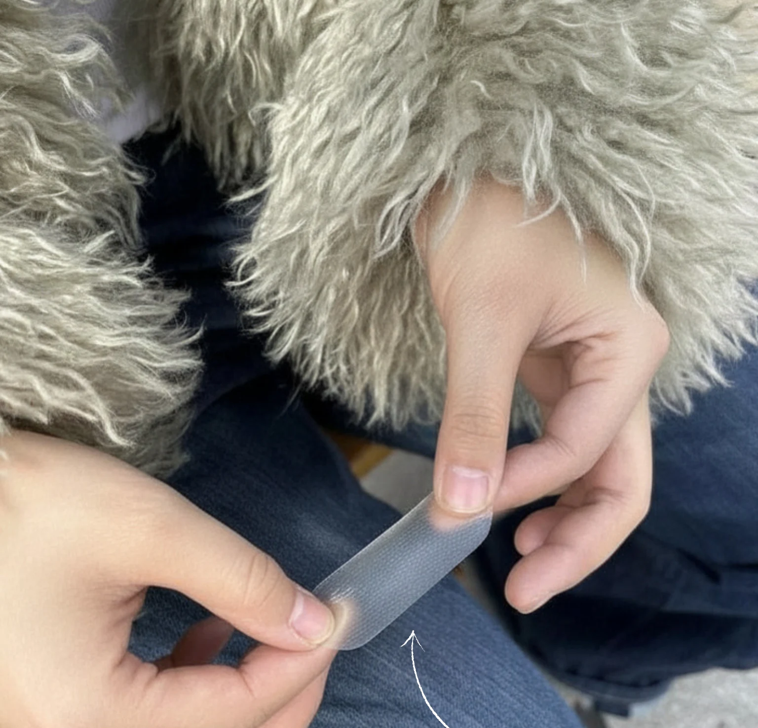 The long, thin translucent BESTIEEZ strip held between two hands